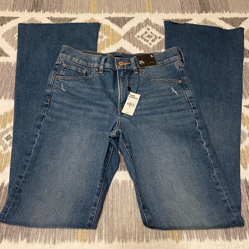 Mid Rise Ripped Raw Hem Flare